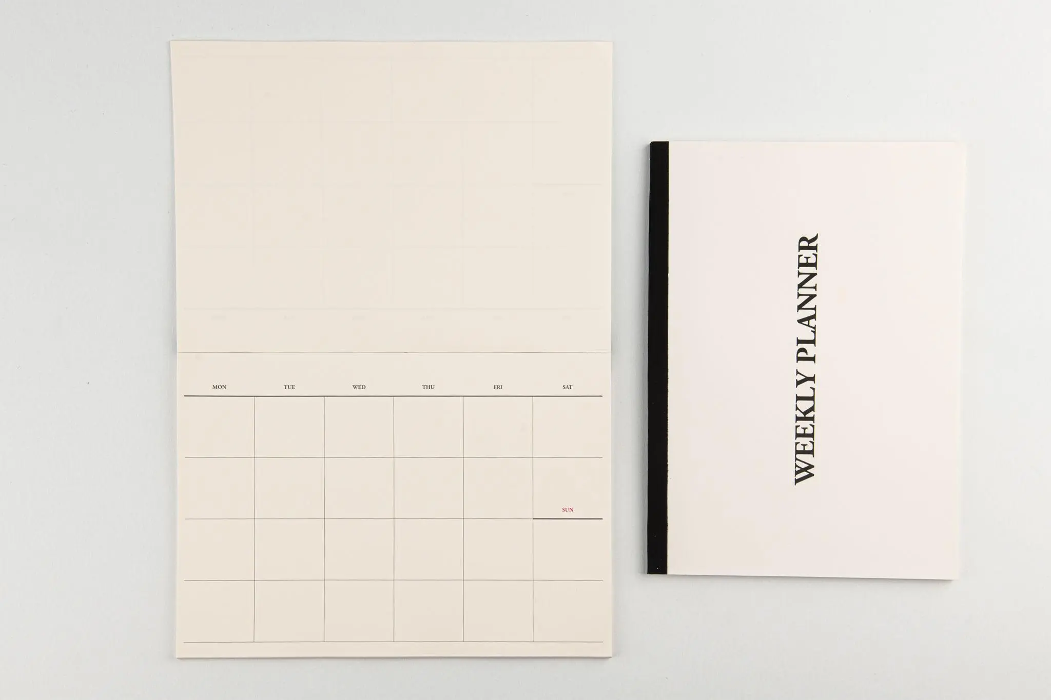 Fees2 Minimal desk calendar and notebook.