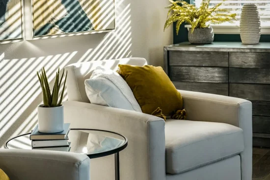 Bright living room with plants and modern furniture.