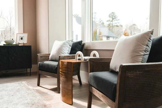 tyrone-sanders-xzb2pU6iSho-unsplash (1) Comfortable seating area with soft natural light.